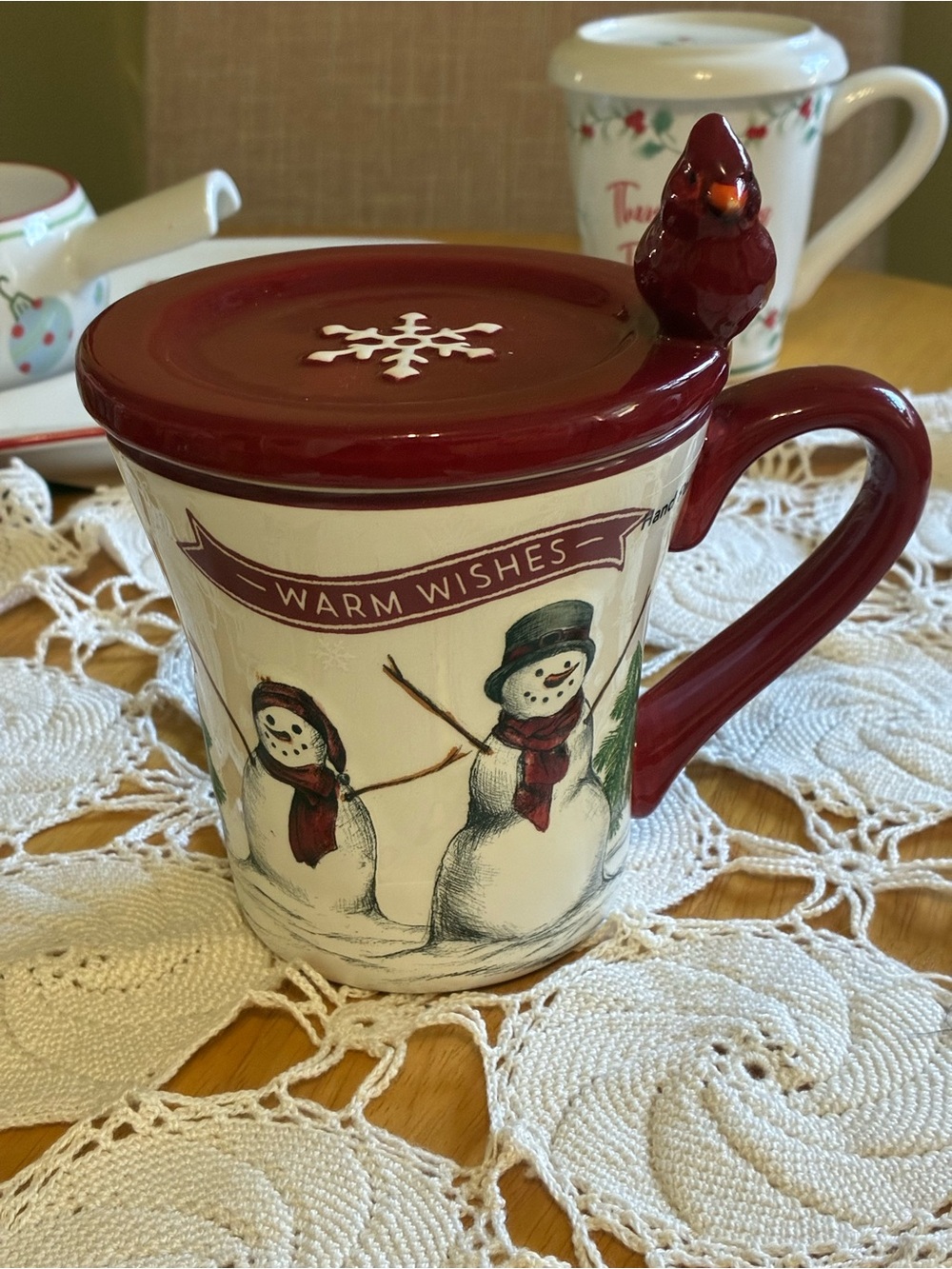 St. Nicholas Square Yuletide Mug with Red Lid, Handle and Cardinal Accent.
